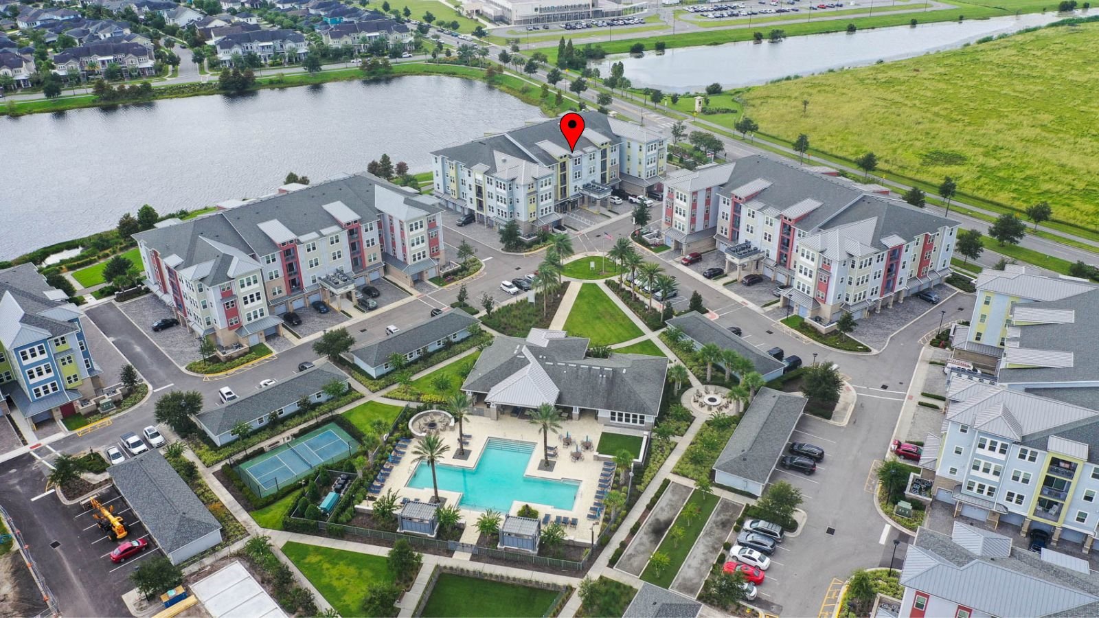 drone shot of condo community with clubhouse